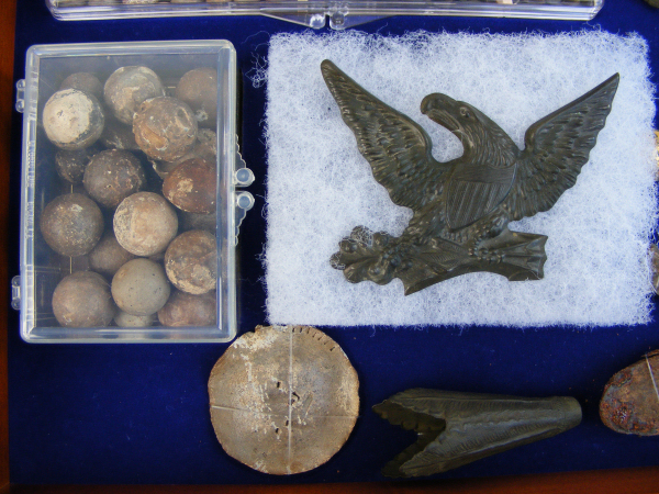 Soldiers poker chip, plastic box with various .36, .54 and .69 Cal musket balls and a lighter color clay marble